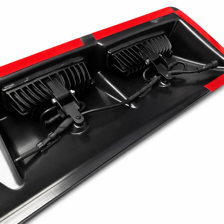 Close-up of a underneath truck roof light with 3m red tape trim.
