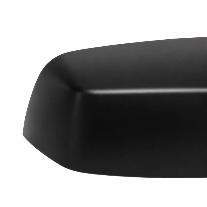 Close-up of a matte black curved automotive part, likely a side mirror housing or trim piece, on a plain white background.