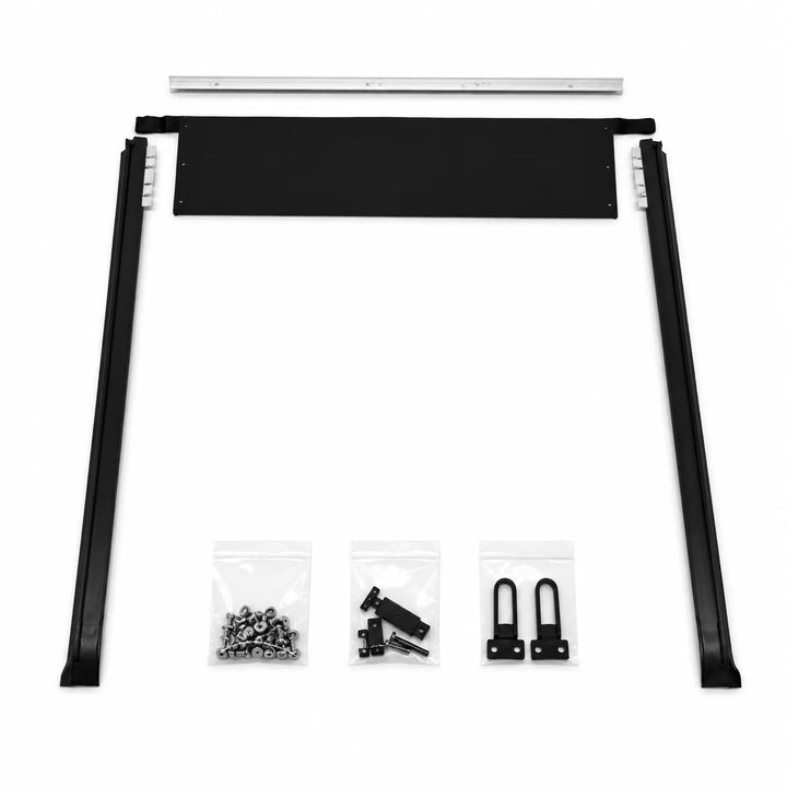 A black metal mounting bracket kit with four long black side rails, a rectangular black crossbar, a silver top rail, and three small clear bags containing mounting hardware, shown on a white background.