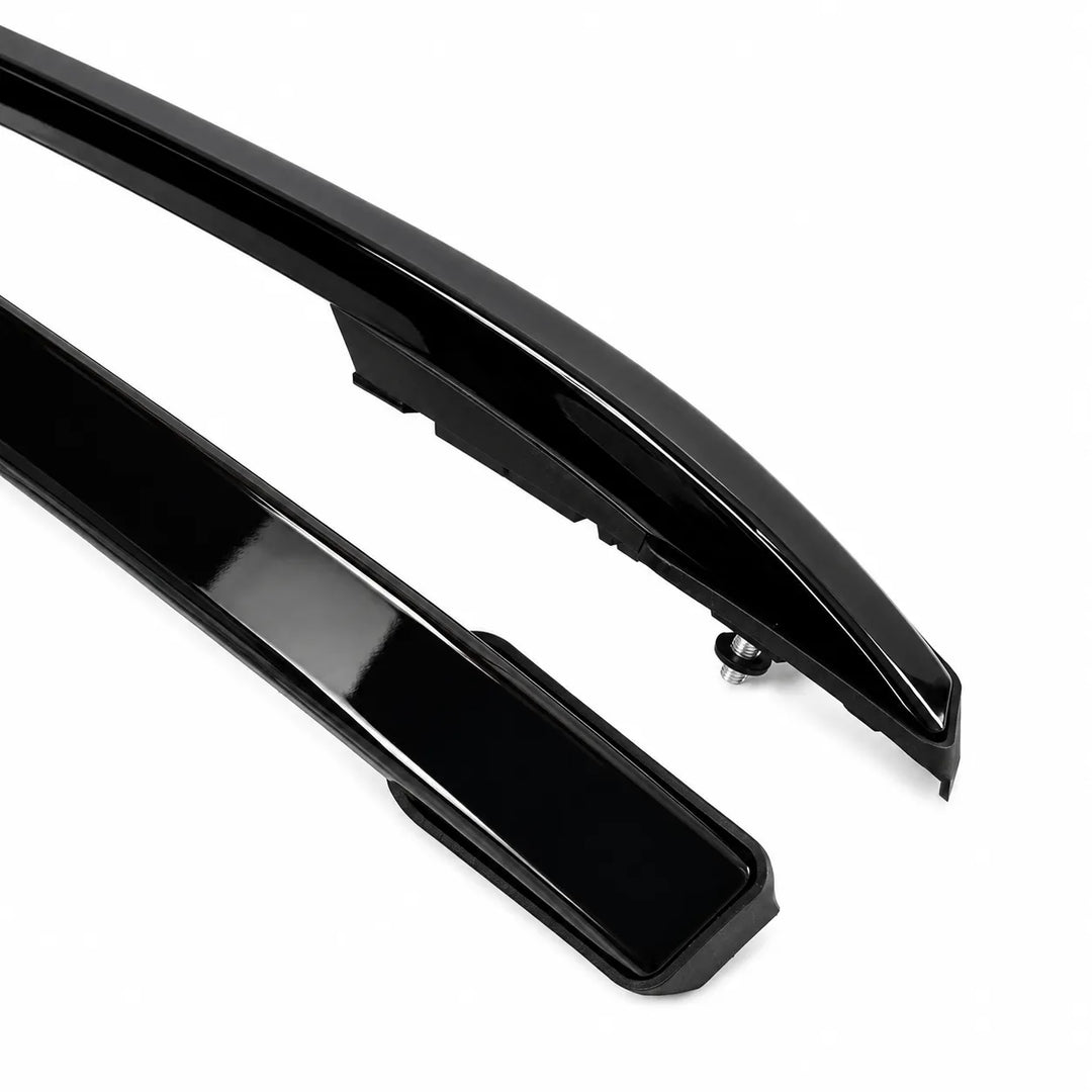 Two glossy black automotive body trim pieces, likely roof rails or side moldings, shown on a clean white background.