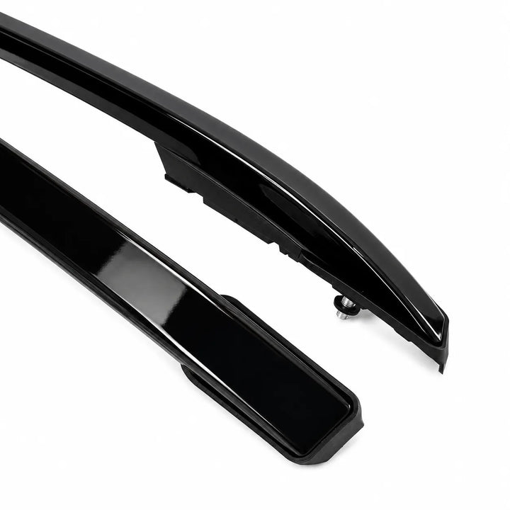 Two glossy black automotive body trim pieces, likely roof rails or side moldings, shown on a clean white background.