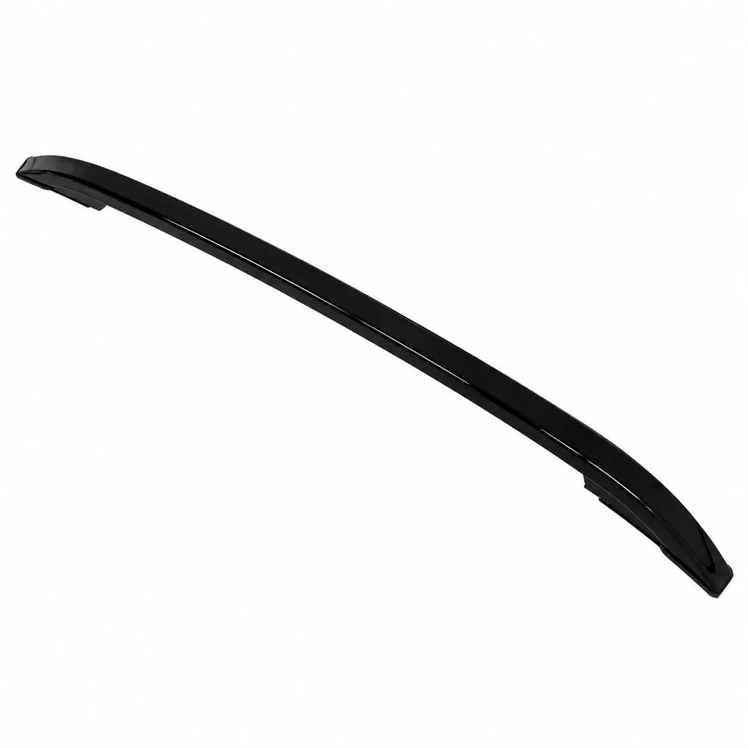 A long, curved black automotive trim piece or bumper lip, photographed on a plain white background.