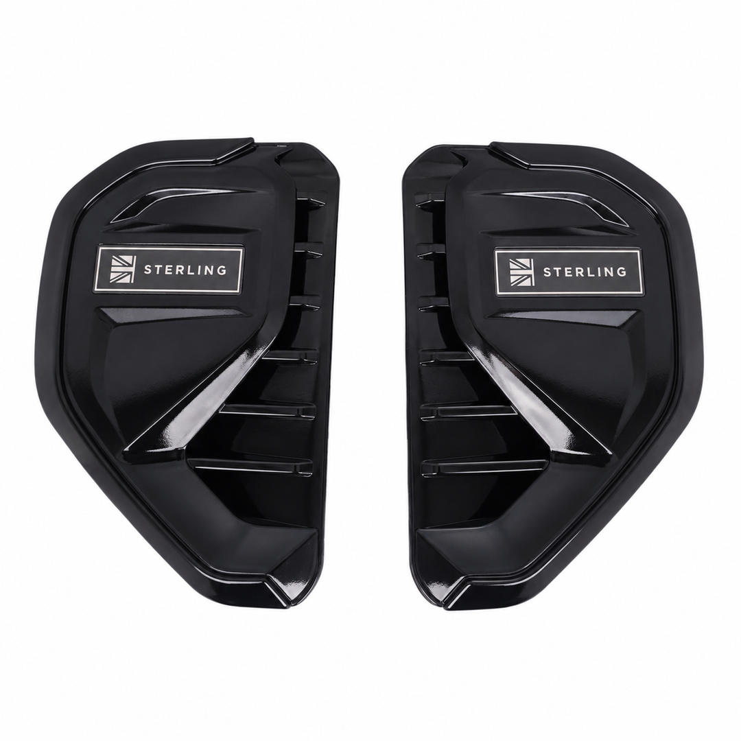 A pair of black side vent covers with a silver 'STERLING' logo and Union Jack emblem, displayed on a clean white background.