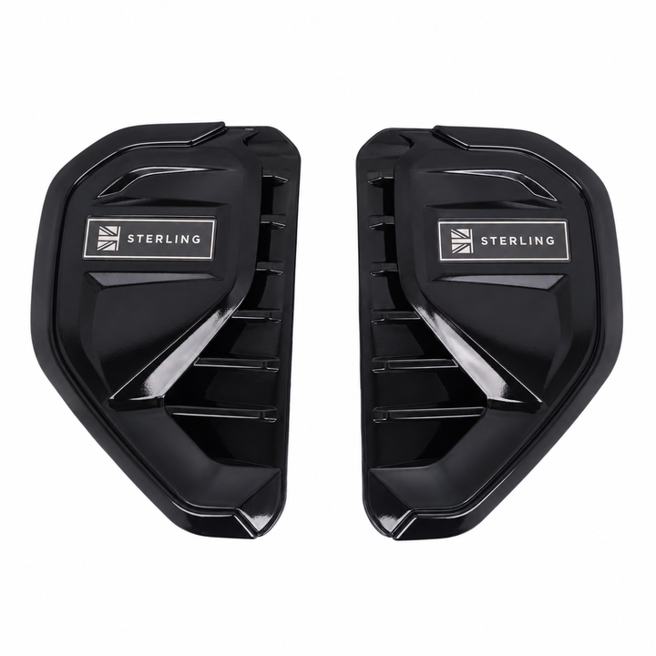 A pair of black side vent covers with a silver 'STERLING' logo and Union Jack emblem, displayed on a clean white background.