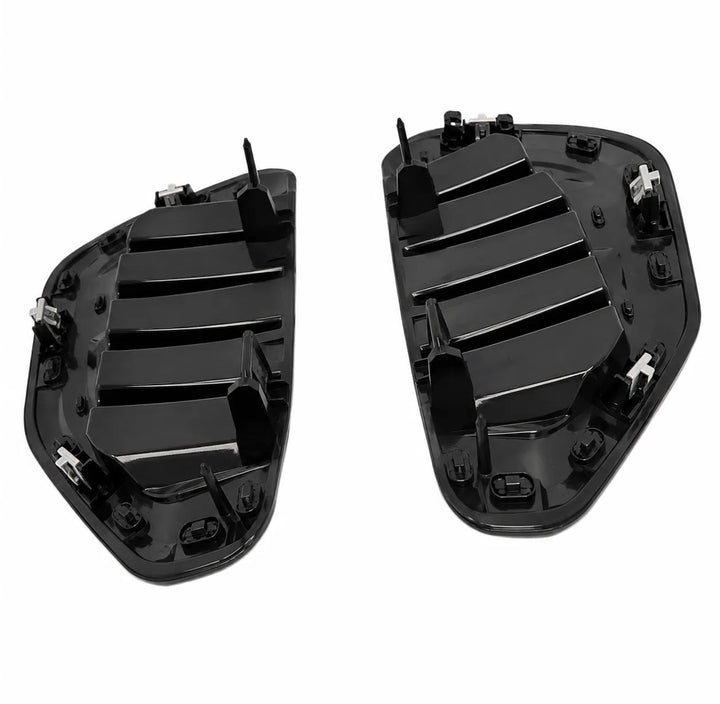 A pair of black plastic automotive side vents, shown from a top-down perspective reverse shot with clips on a solid white background.