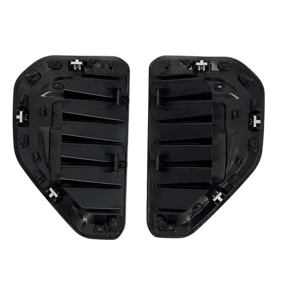 A pair of black plastic automotive side marker light housings, showing both the front and back views with mounting clips, isolated on a white background.
