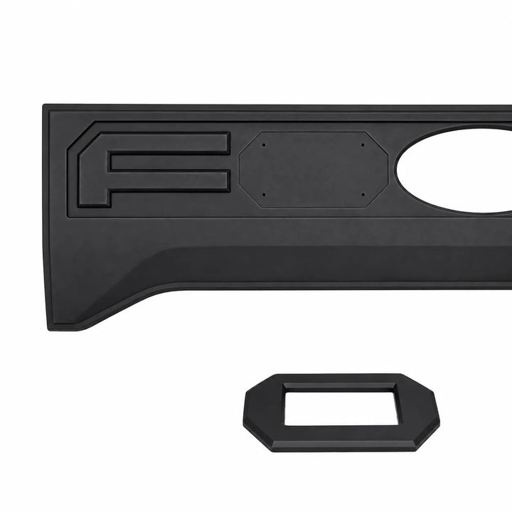 A black plastic truck tailgate bed lid insert with raised lettering and an oval cutout, letter 'O' shown seperate and shown against a plain white background.