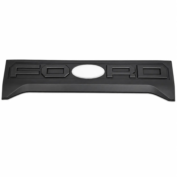 A black textured Ford emblem badge with raised lettering and a central oval cutout, shown on a plain white background.