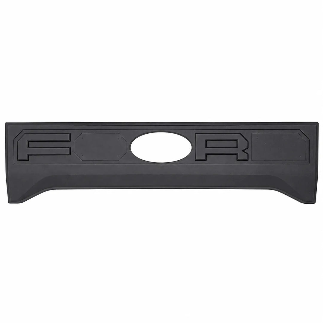 A black plastic truck tailgate bed lid insert with raised lettering and an oval cutout, shown against a plain white background.