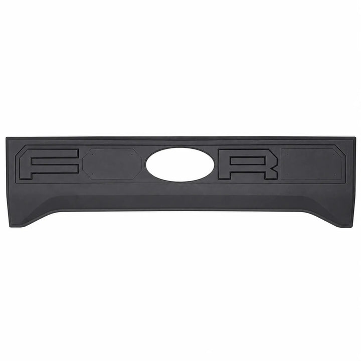 A black plastic truck tailgate bed lid insert with raised lettering and an oval cutout, shown against a plain white background.