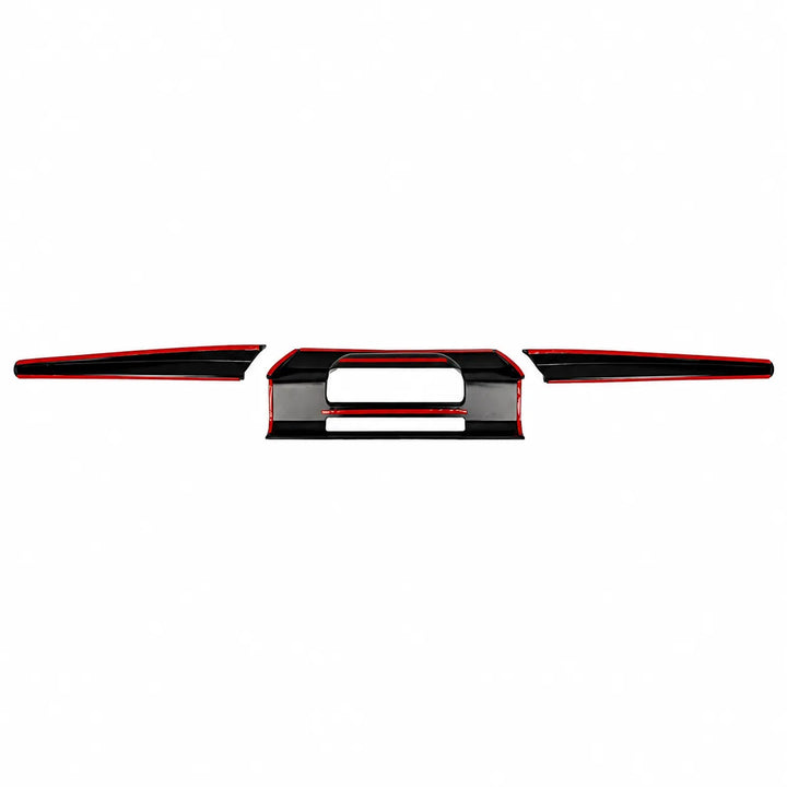 A set of glossy black dashboard trim pieces with red accent lines, arranged symmetrically on a plain white background.