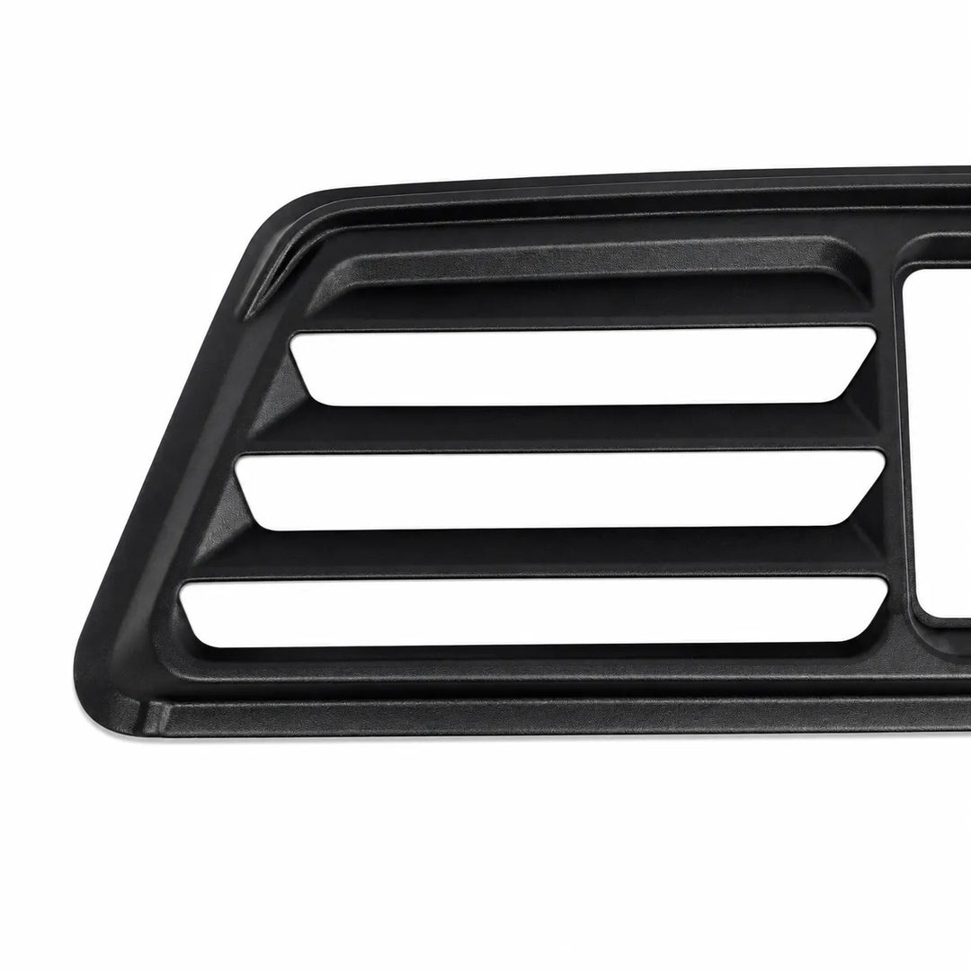A close-up of a black plastic automotive grille or vent trim piece with three horizontal slotted openings, shown on a plain white background.