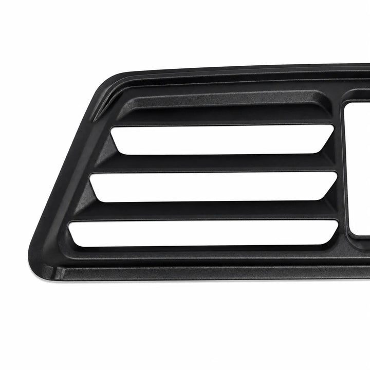 A close-up of a black plastic automotive grille or vent trim piece with three horizontal slotted openings, shown on a plain white background.