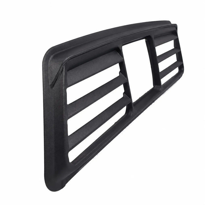 A black plastic automotive grille trim piece with horizontal slats and a rectangular cutout, shown on a plain white background.