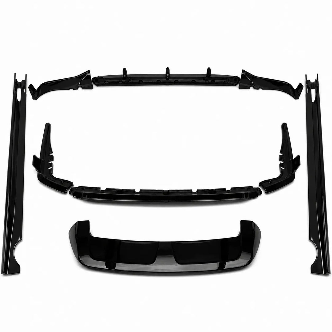 A set of glossy black automotive body trim pieces, including side skirt molds, a front splitter lip, and a lower trim valance diffuser bar, black spoiler wing arranged on a plain white background.