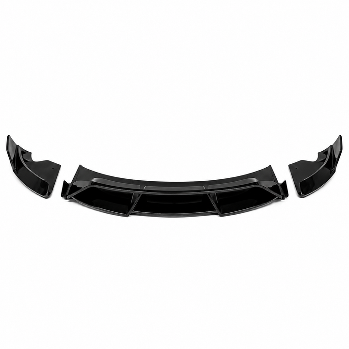 A high-up image of a glossy black plastic splitter, 3 piece Front Lower Splitter bumper extension lip shown against a plain white background, for a tesla model 3 facelift
