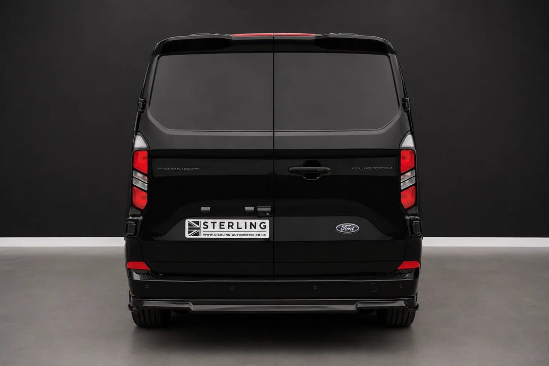 A rear Sterling customized Ford Transit van with rear diffuser splitter, photographed in a studio setting.