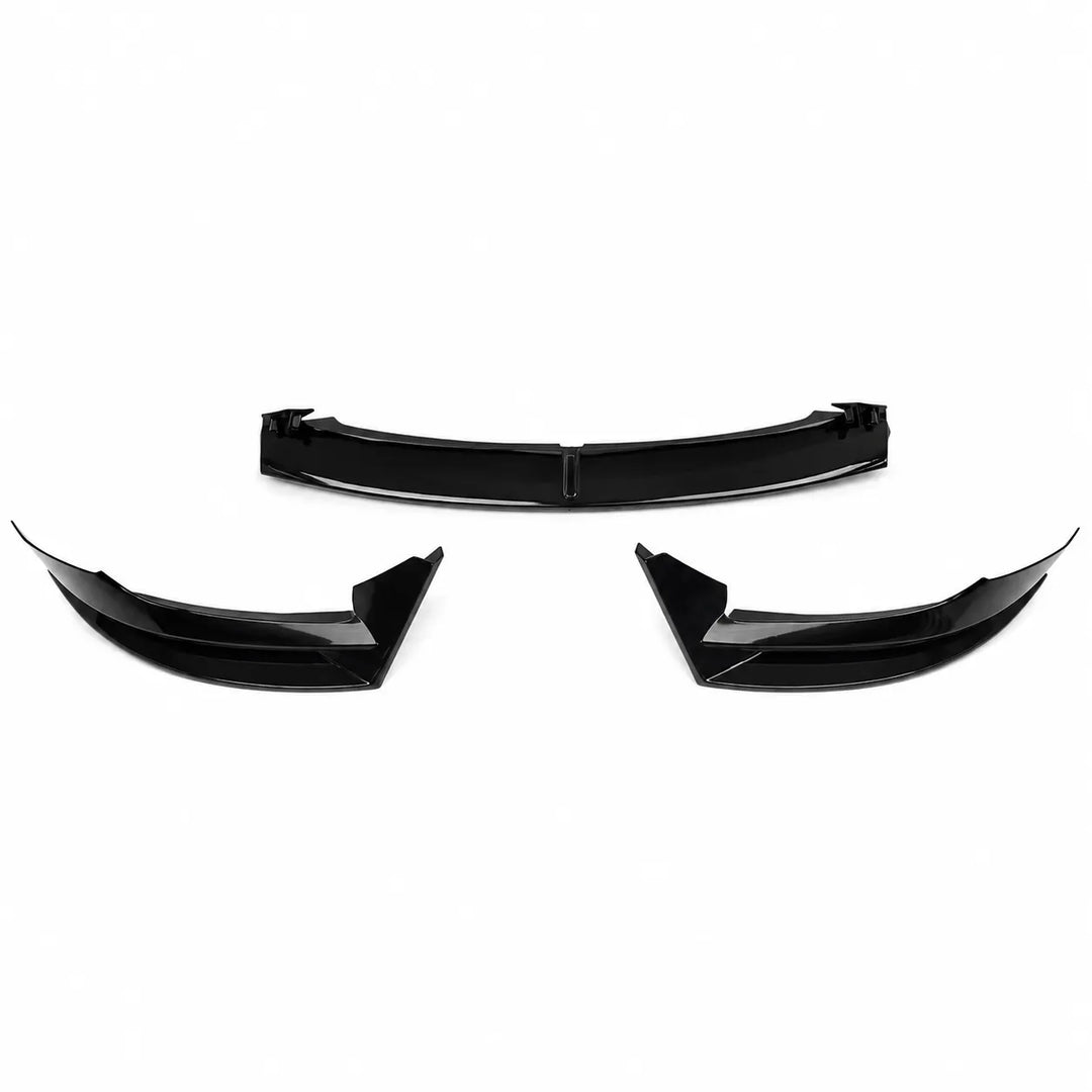Three glossy black automotive body trim pieces, including a wide center section and two matching curved lower sections, for a front splitter fitting tesla model 3 displayed on a plain white background.