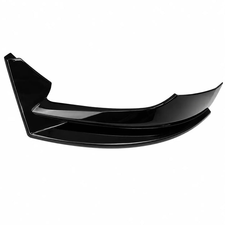 A glossy black automotive body part, likely a front splitter or lip spoiler trim, shown against a plain white background.